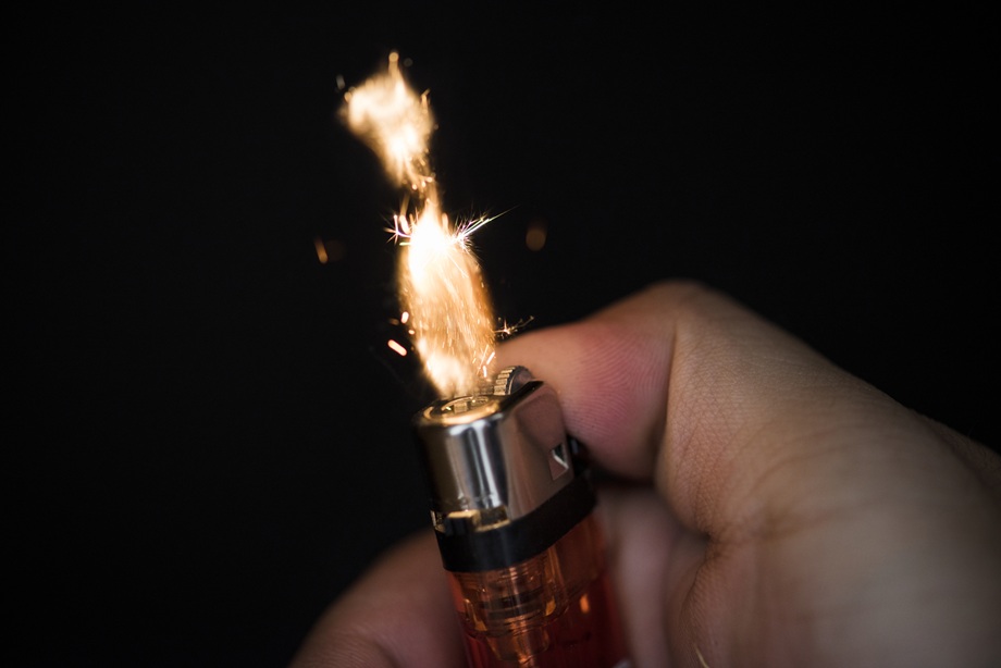 macro-shot-hand-holding-lighter.jpg